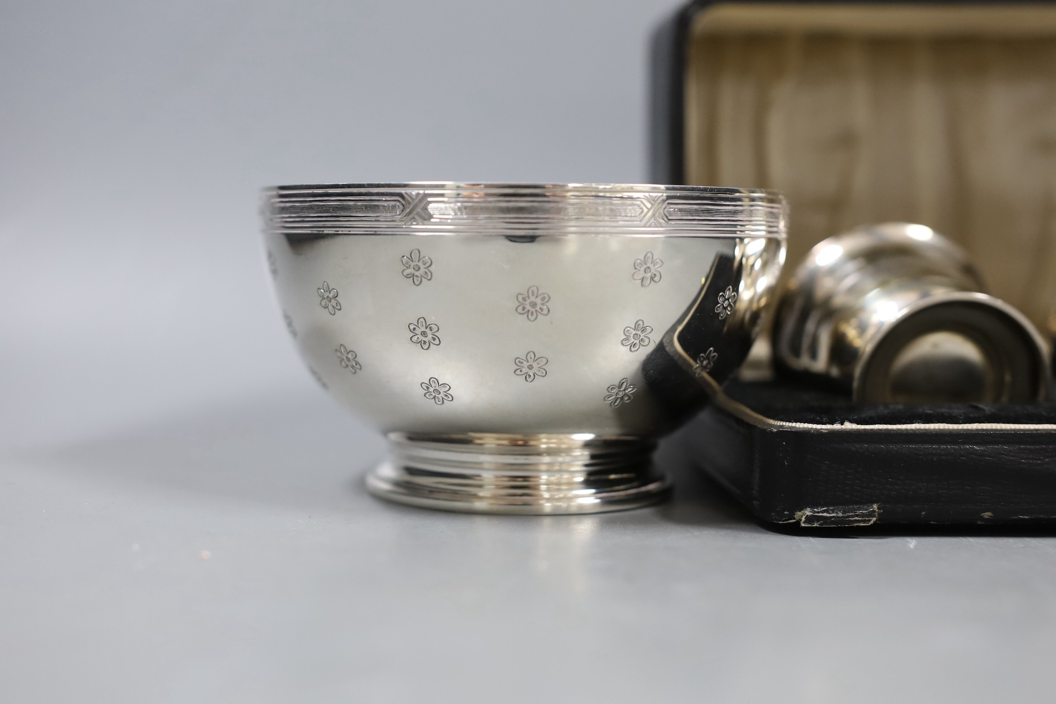 A modern silver sugar bowl, 11.2cm, 6oz a case pair of silver salts and a silver mounted trumpet vase.